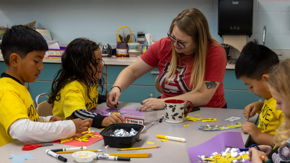 MES students and staff working on craft