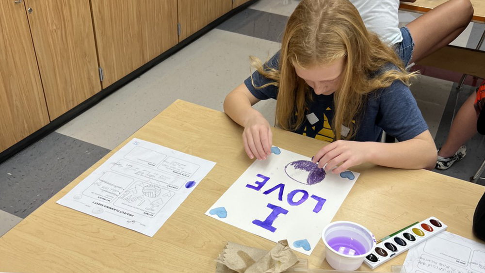 student working on passion project