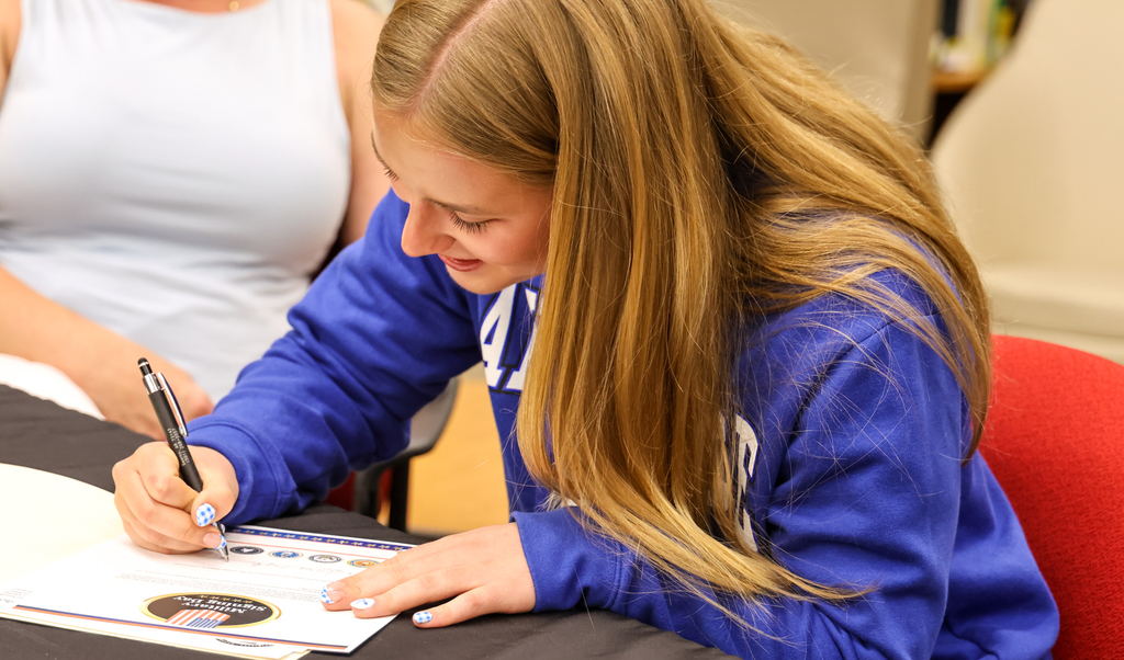 Anna Engle signing certificate