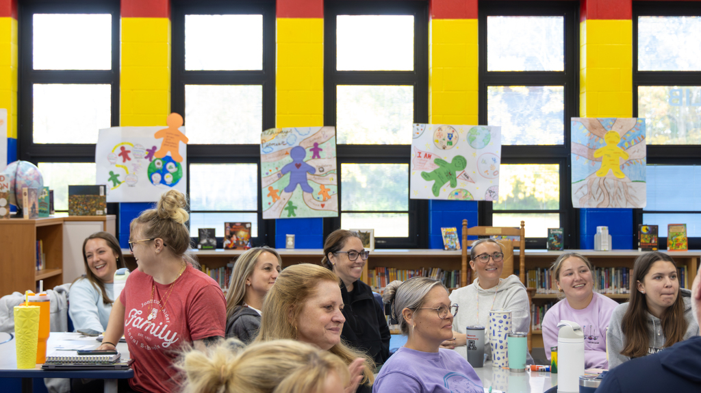 staff smiling at presentation