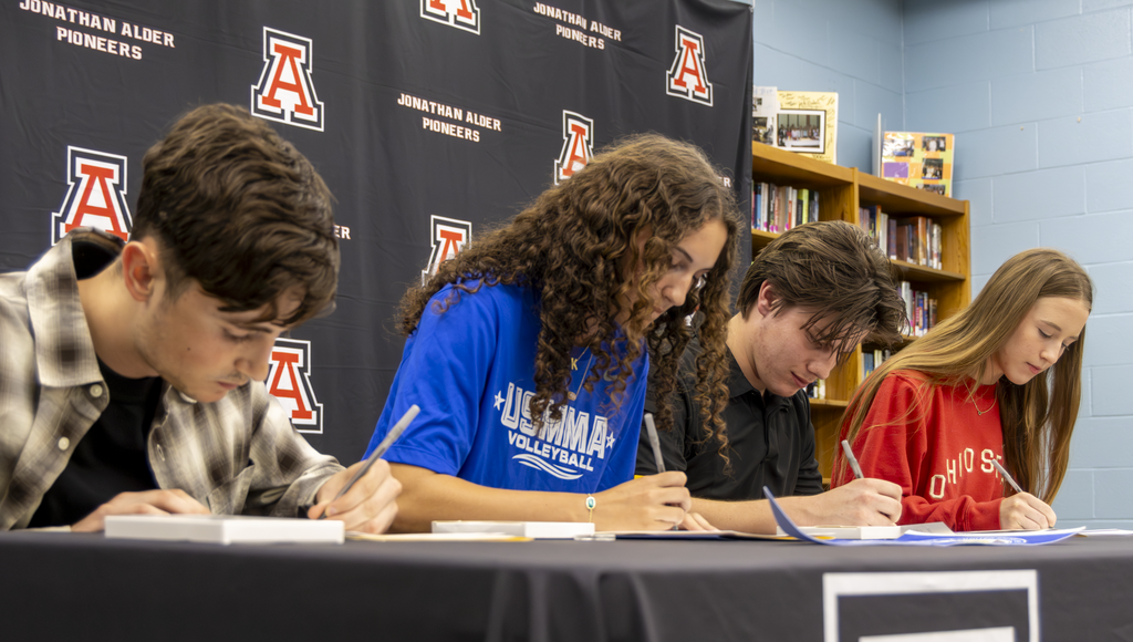 students signing
