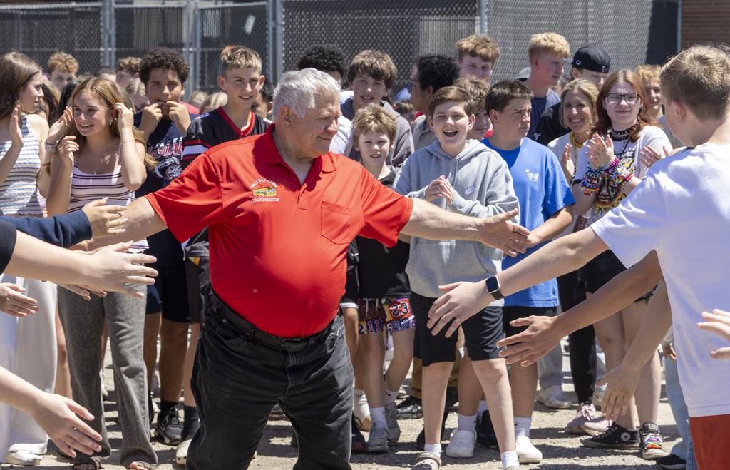 lach high fiving students