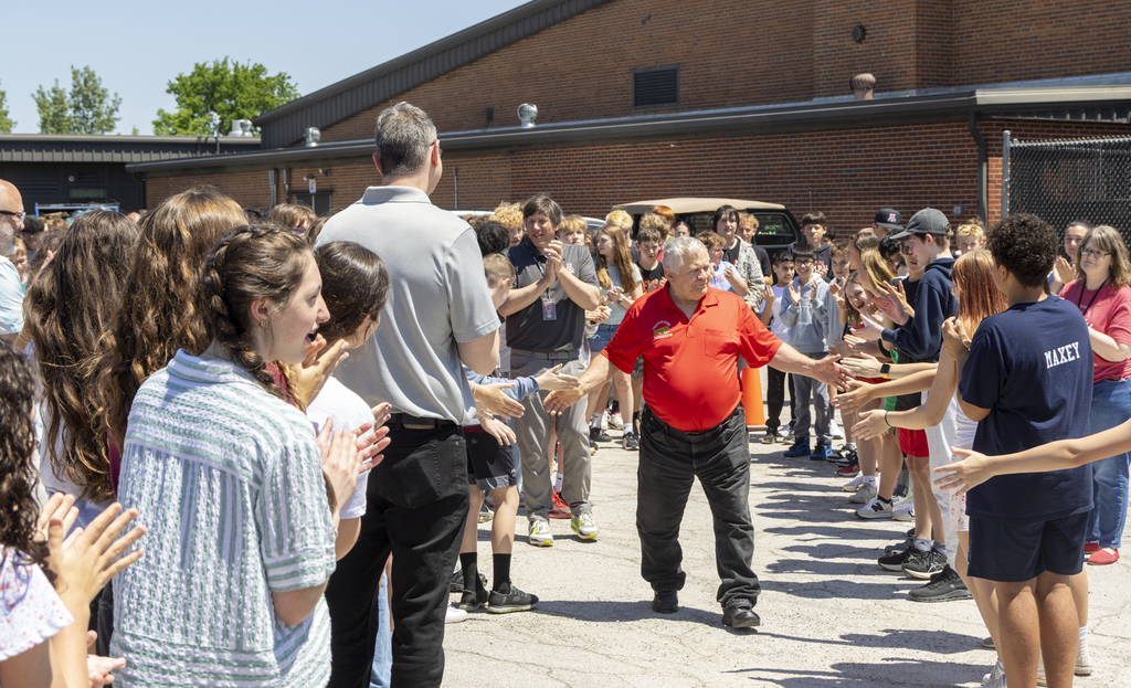 lach high fiving students
