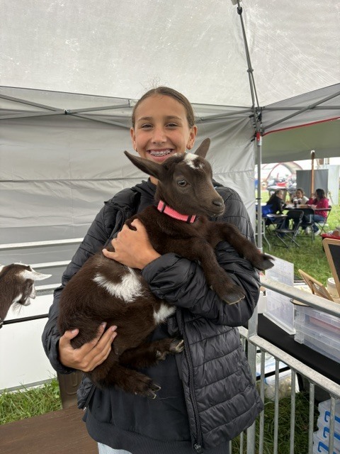 student with goat