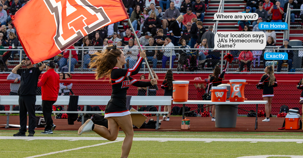 cheerleader running with flag