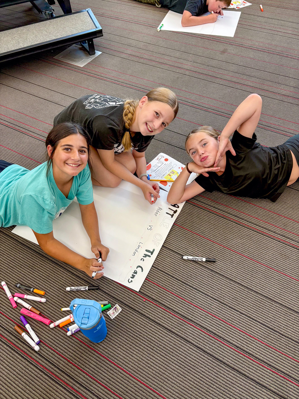 students decorating a poster