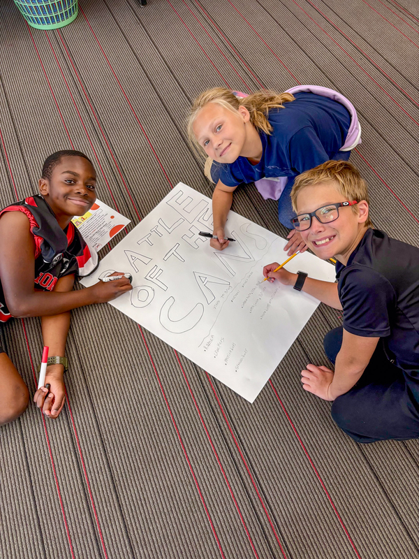 students decorating a poster