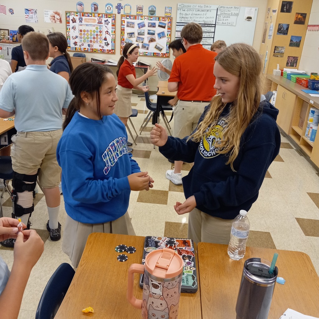 students playing paper rock scissors for poker chips