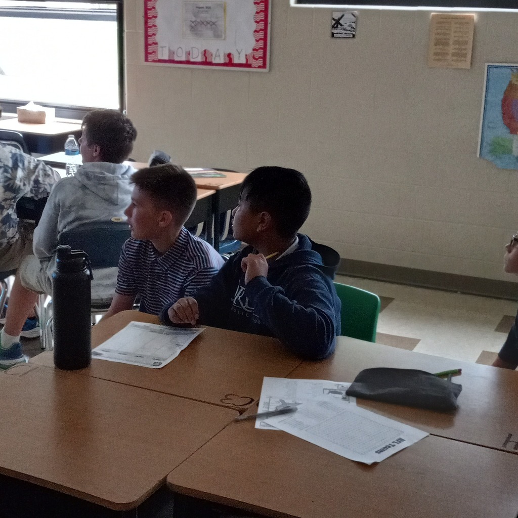 Students working together at a desk