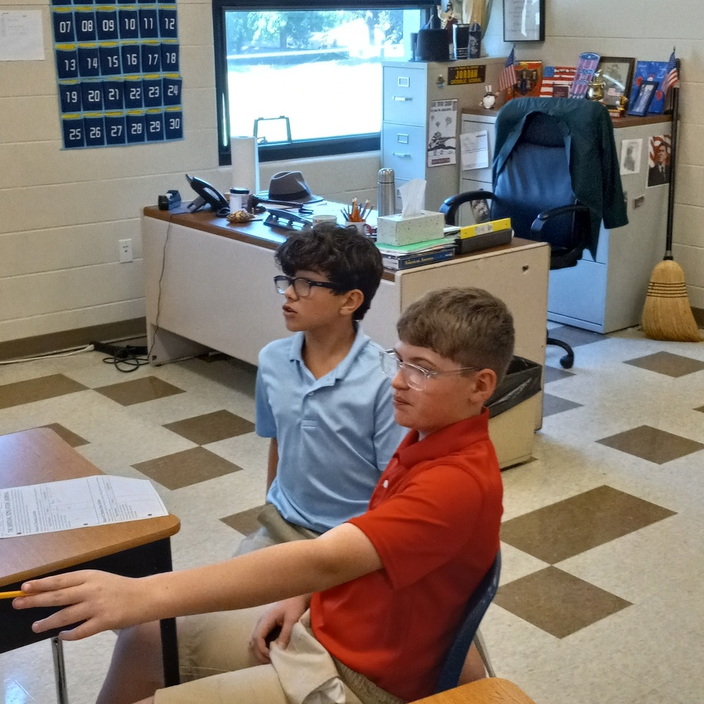 students giving answers to the clues