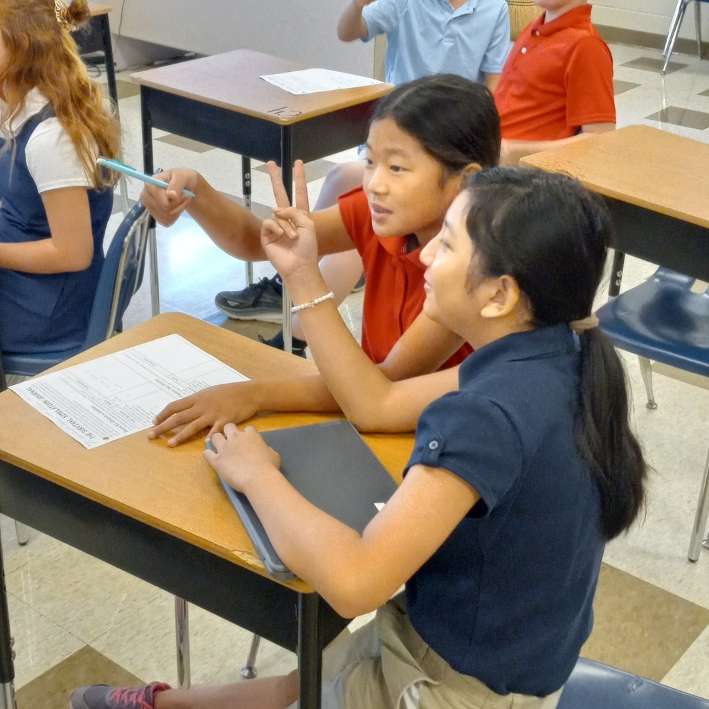 students giving answers to the clues