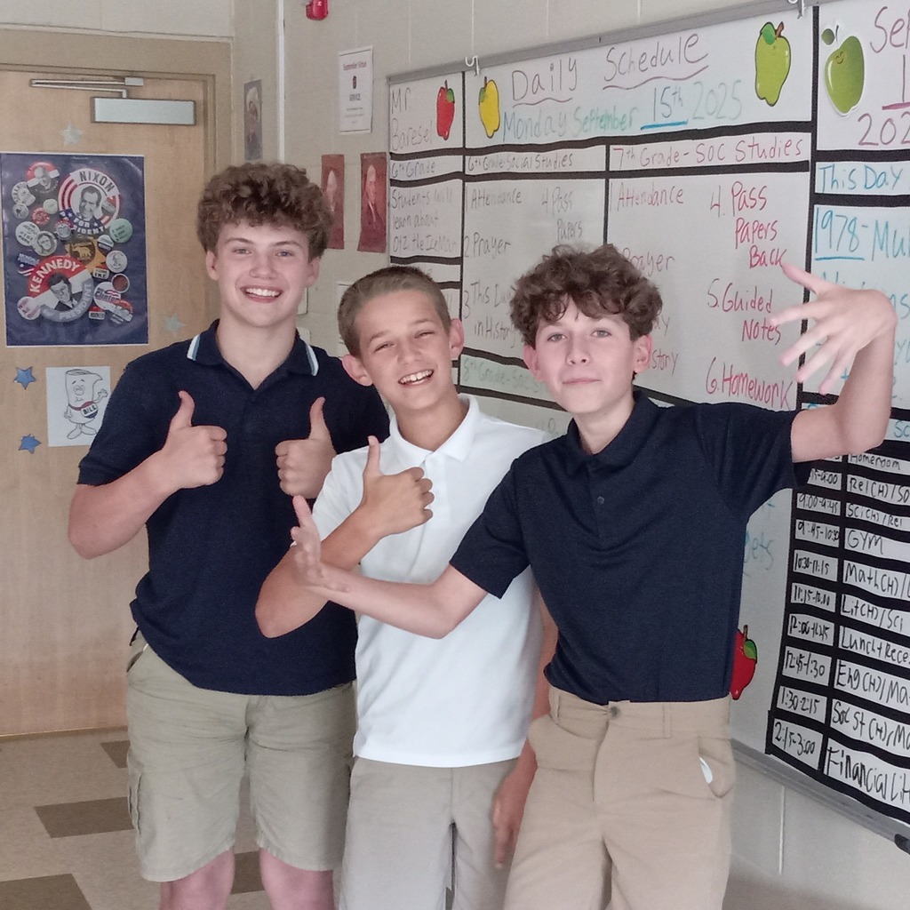 students posing in a classroom