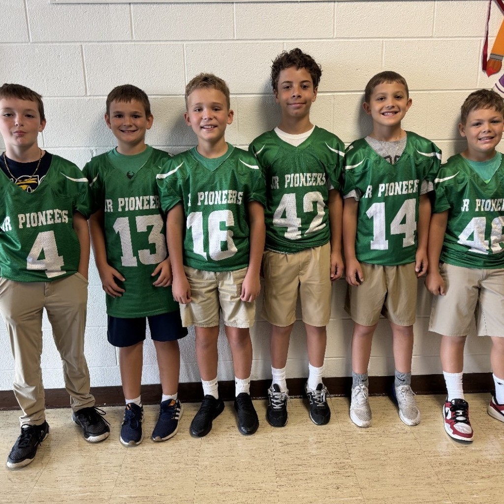 group photo of football players in hall