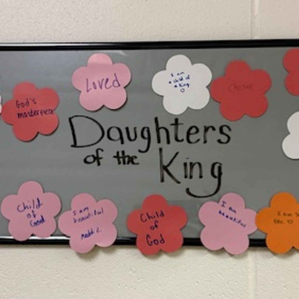 bulletin board with pastel colored flowers