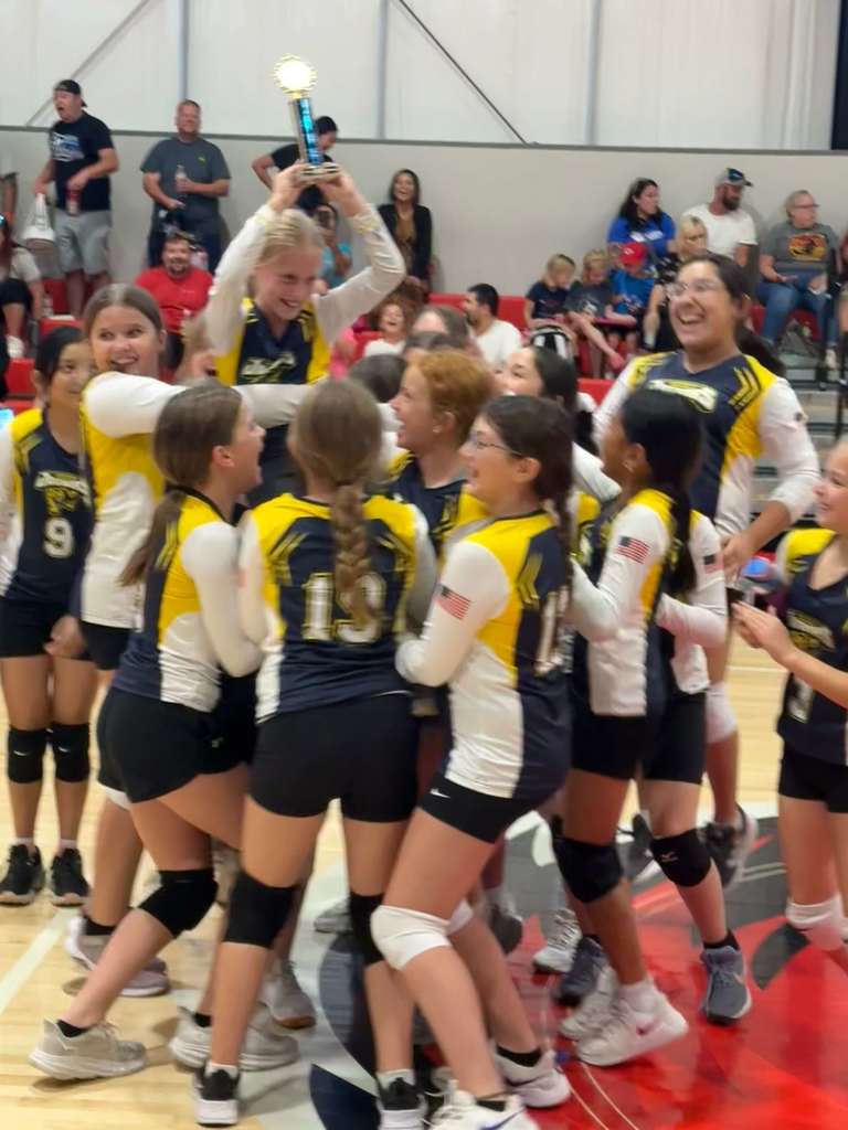 6th grade volleyball team receiving 3rd place trophy