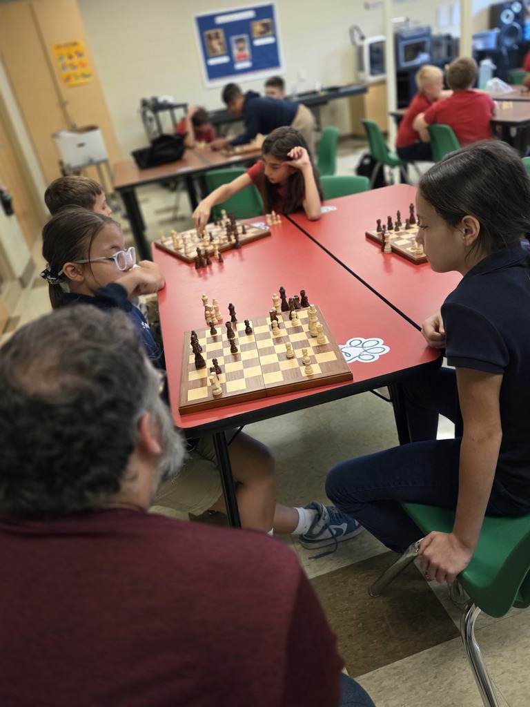 students playing chess in a classroom