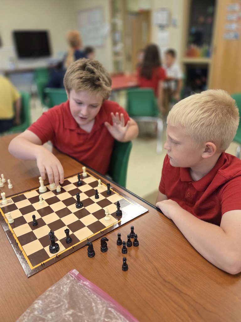 students playing chess in a classroom