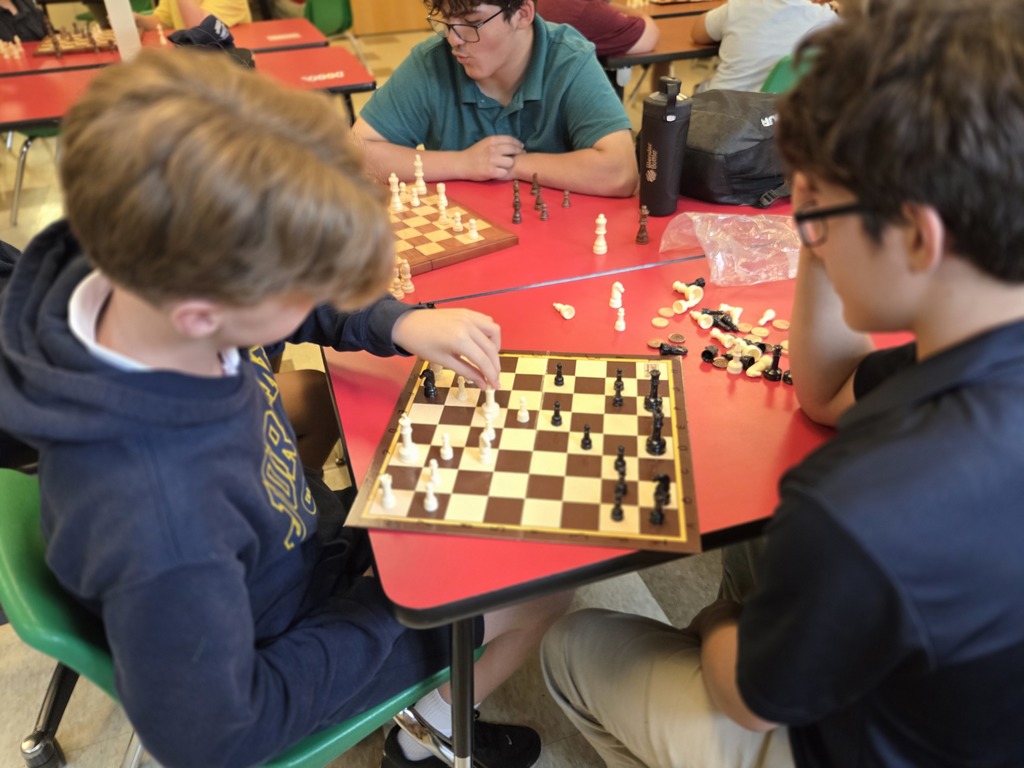 students playing chess in a classroom
