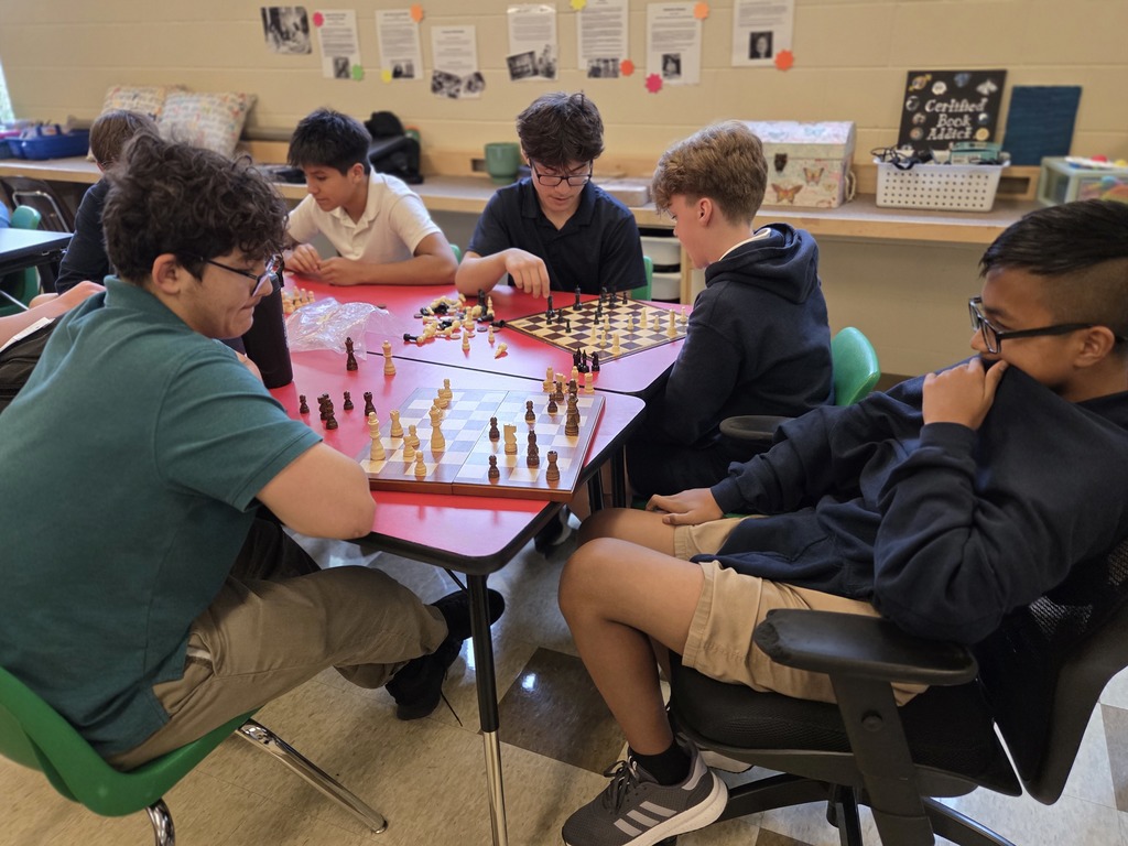 students playing chess in a classroom