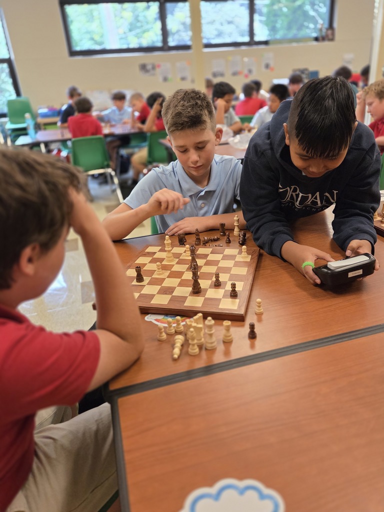 students playing chess in a classroom