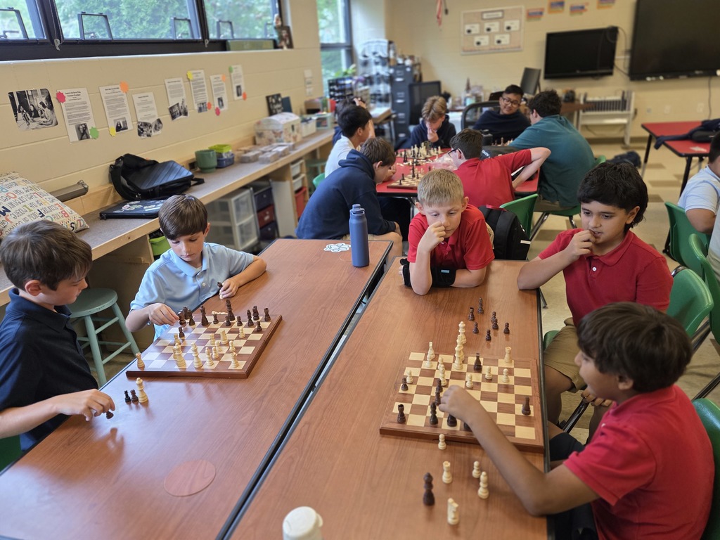 students playing chess in a classroom