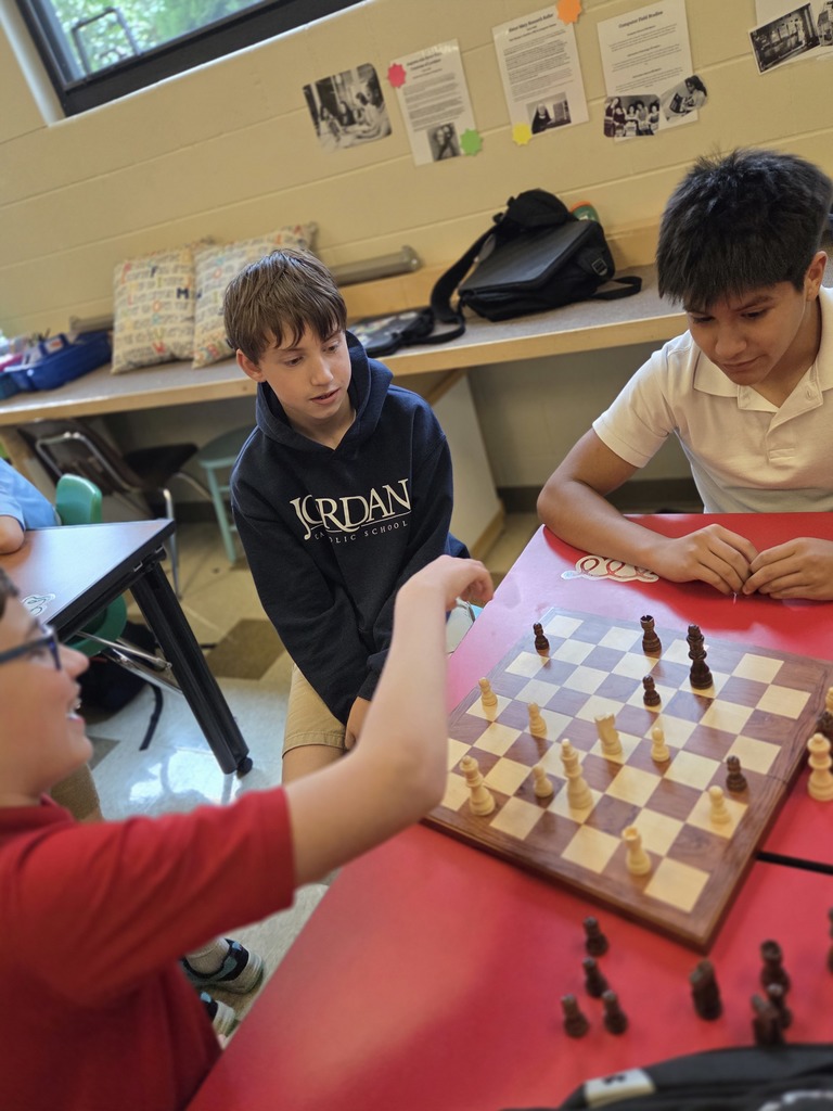 students playing chess in a classroom