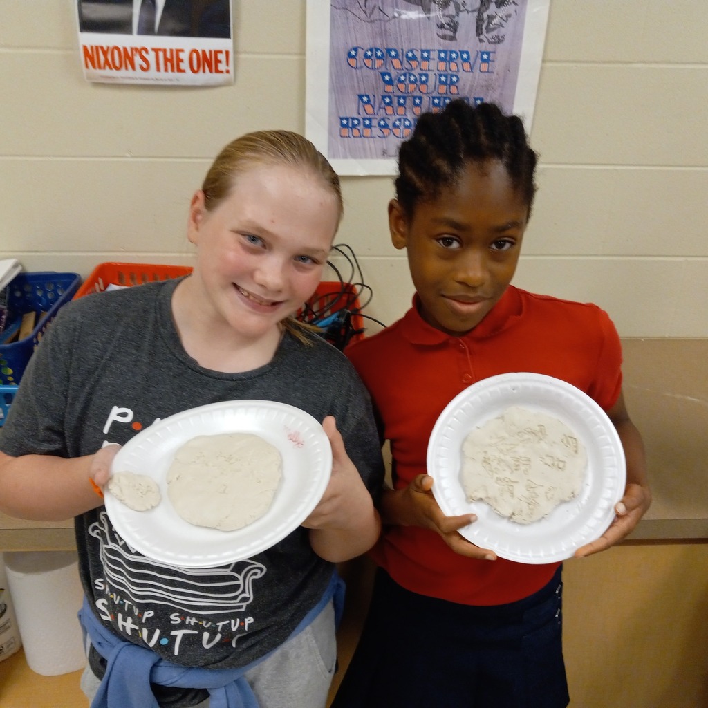 students writing cuneiform