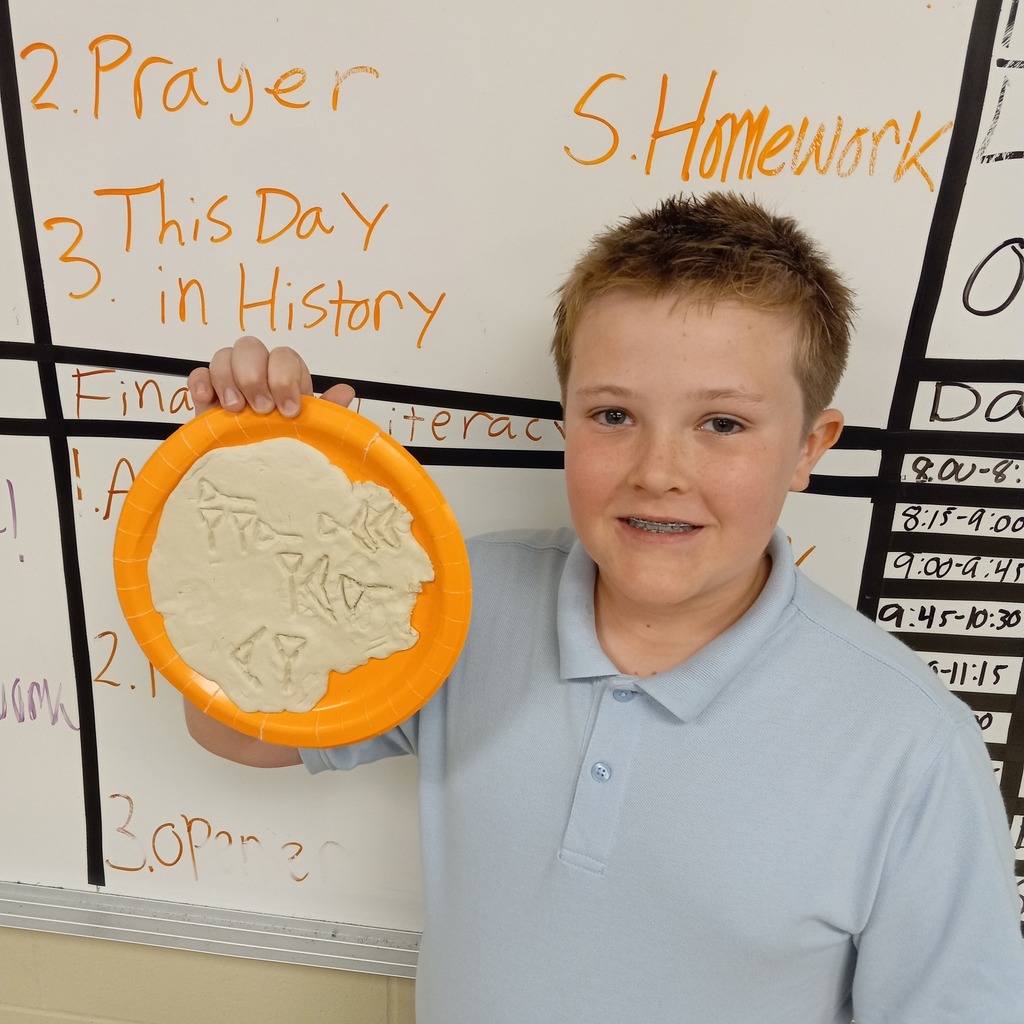 students writing cuneiform