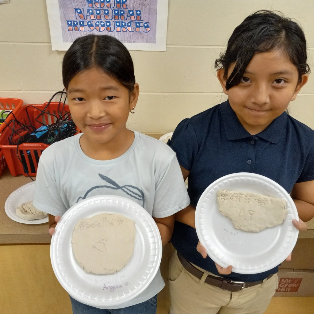 students writing cuneiform