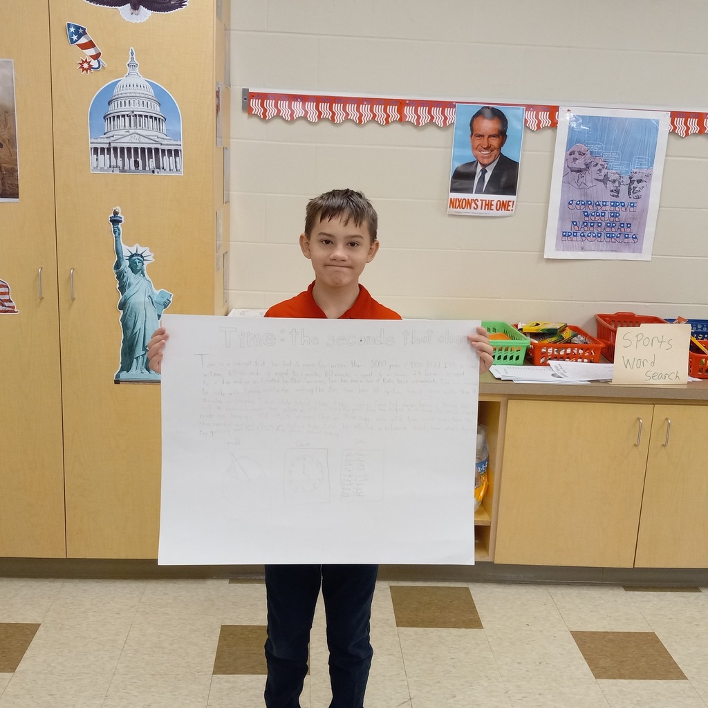 student posing with presentation