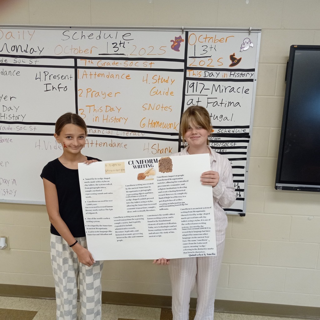 student posing with presentation