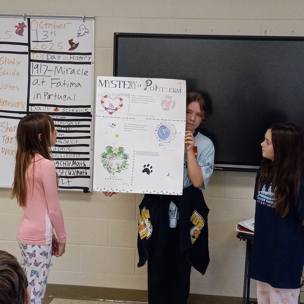 student posing with presentation