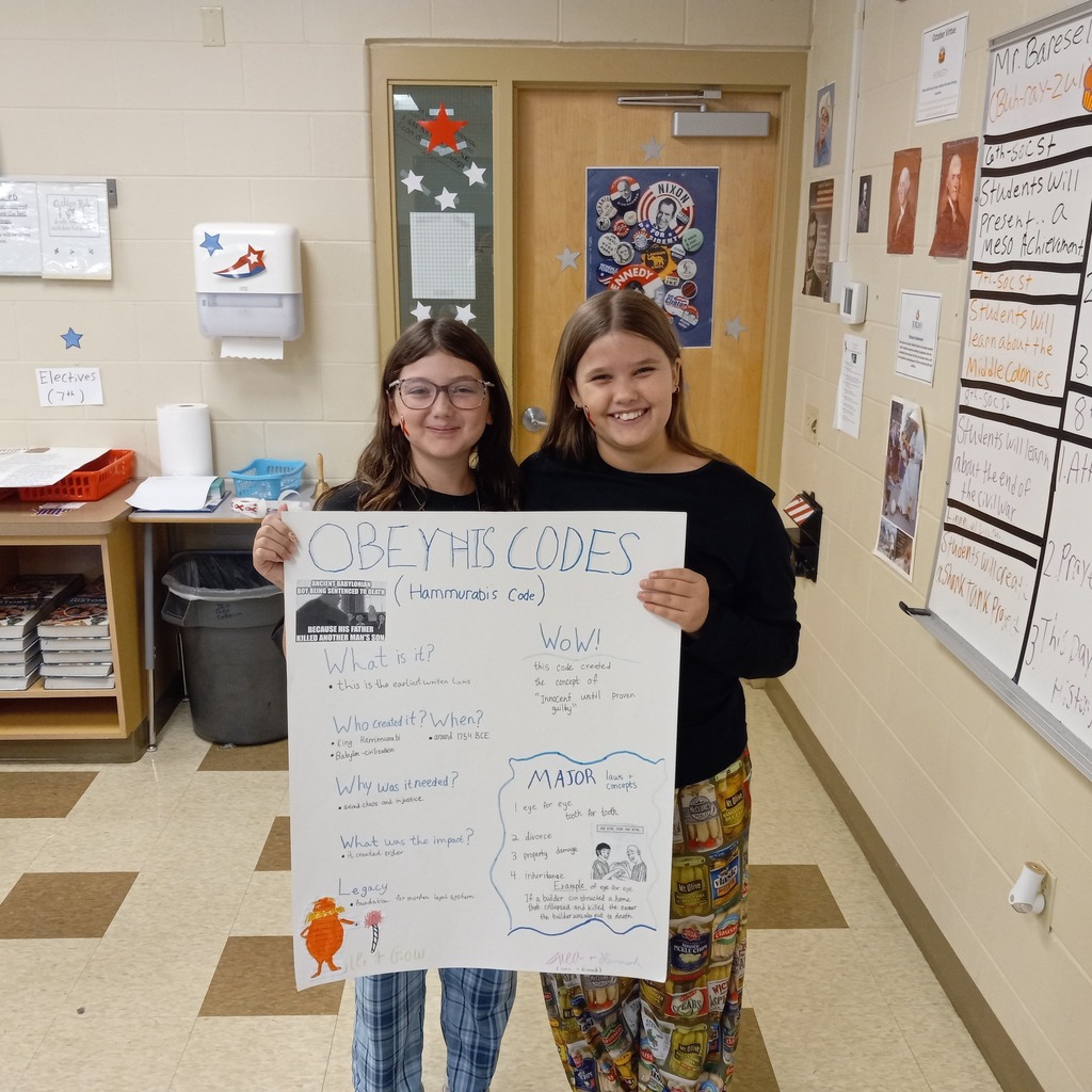 student posing with presentation