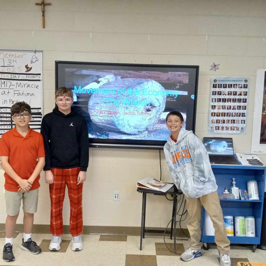 student posing with presentation