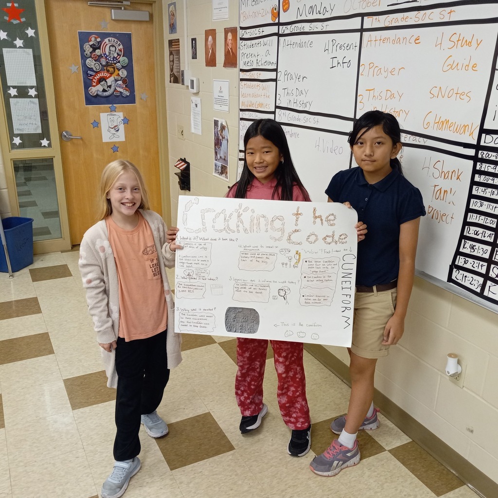 student posing with presentation