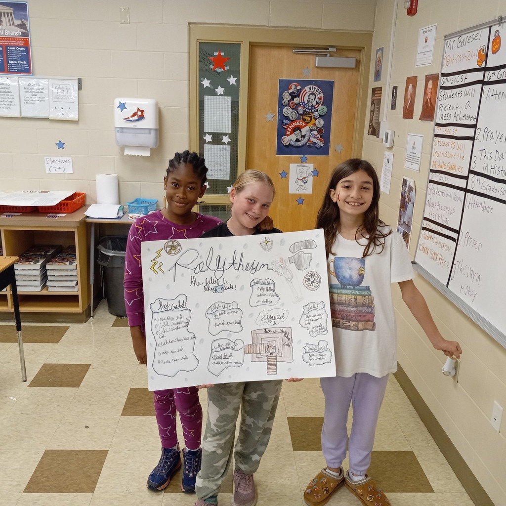 student posing with presentation