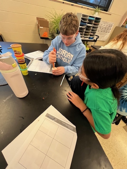 students taking core samples from playdoh