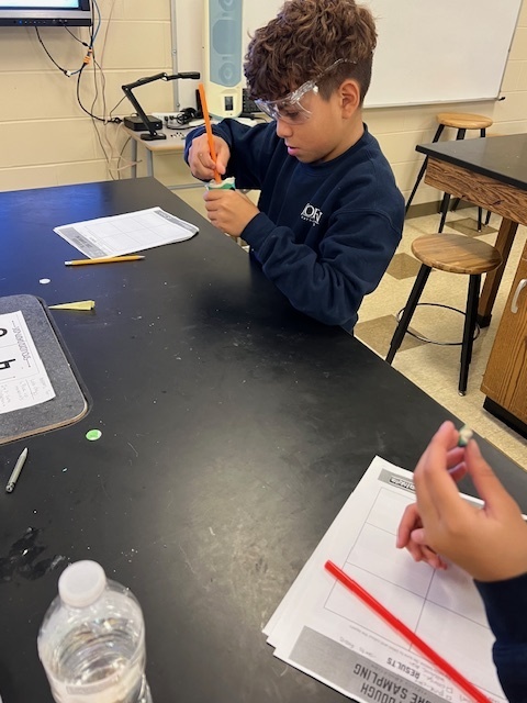 students taking core samples from playdoh