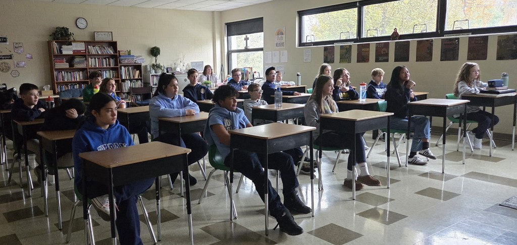 students watching Pope Leo on livestream