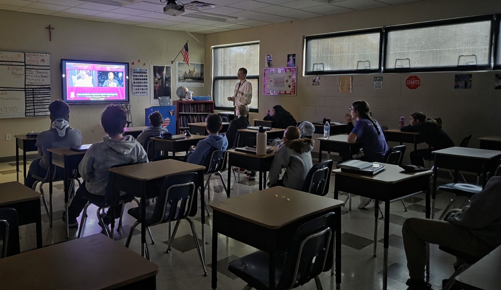students watching Pope Leo on livestream
