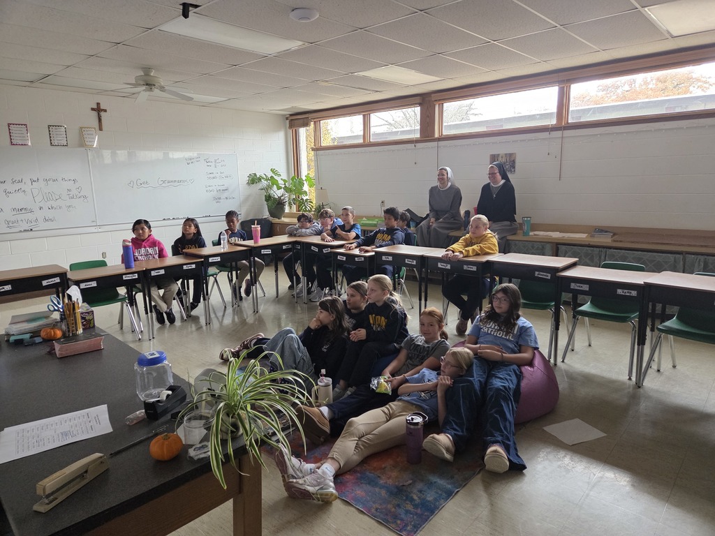 students watching Pope Leo on livestream