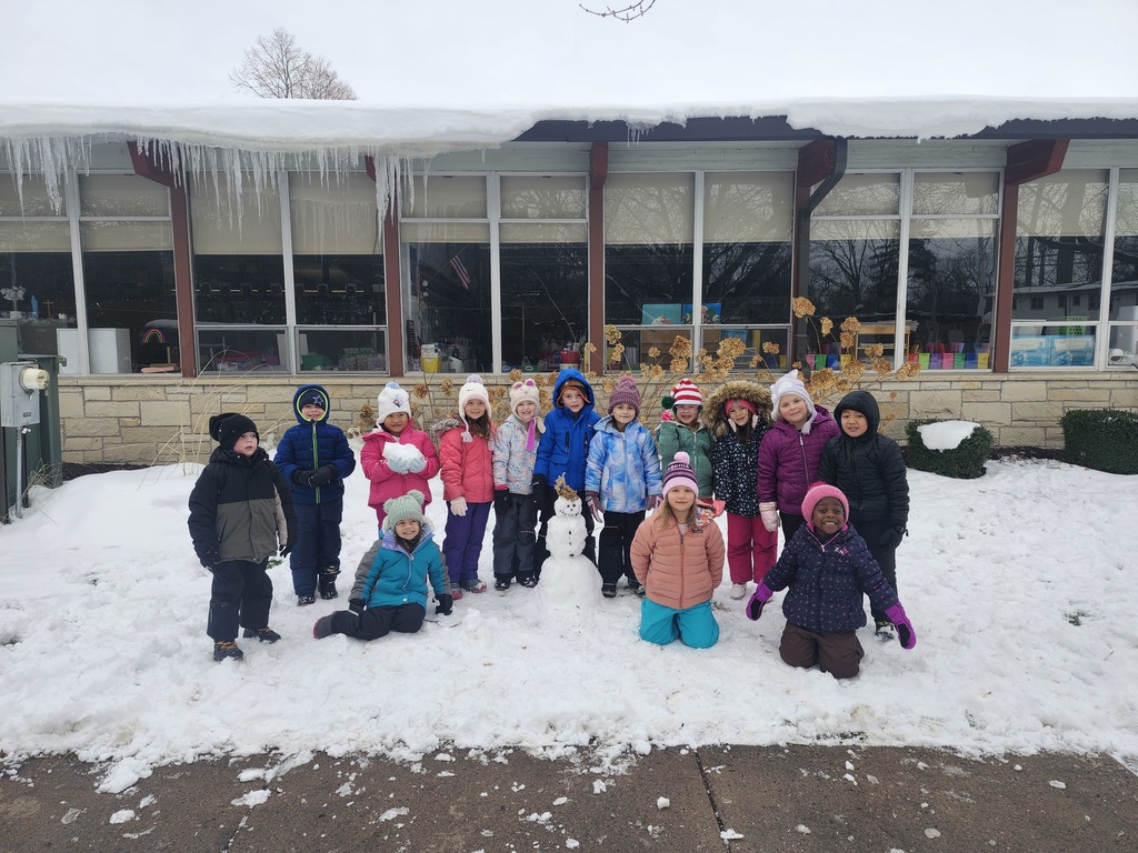 group photo of students with small snowman