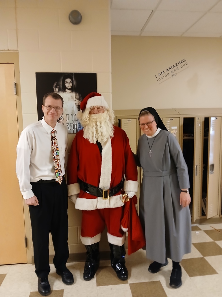 Santa posing with two teachers
