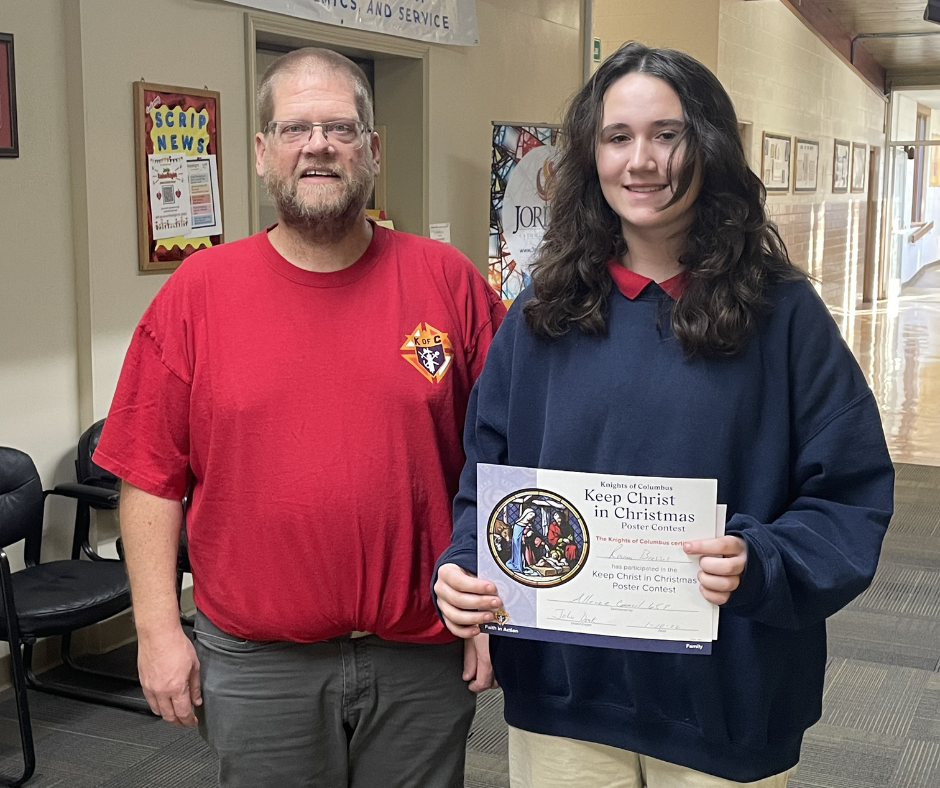 Adult and student posing together with certificate
