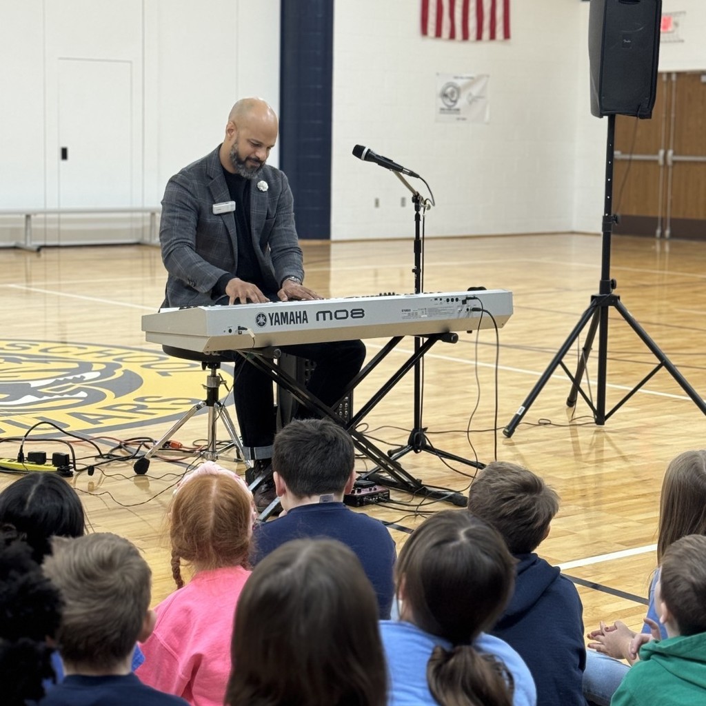 man playing keyboard in a gym