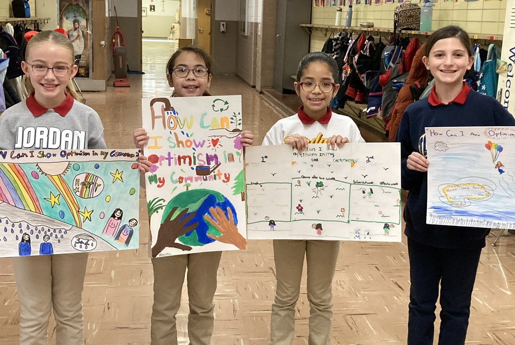 students posing with their winning posters