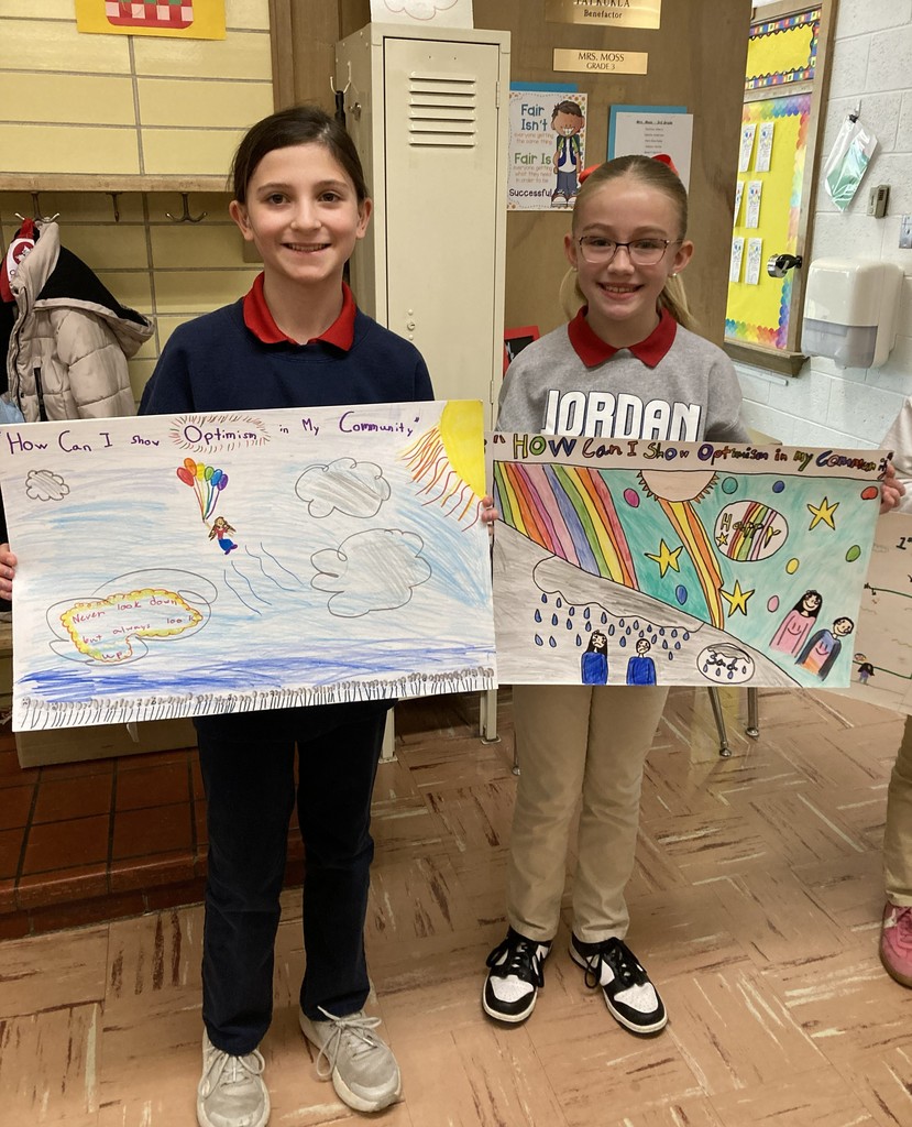 students posing with their winning posters