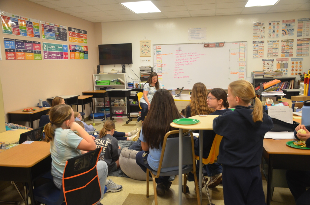 students listening to teacher