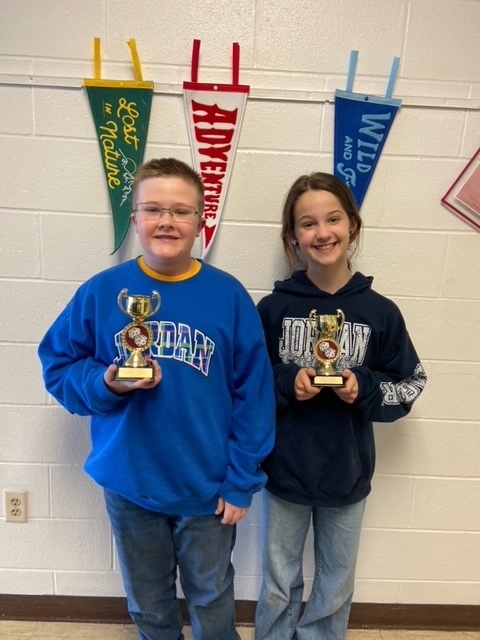 Contig winners holding trophies