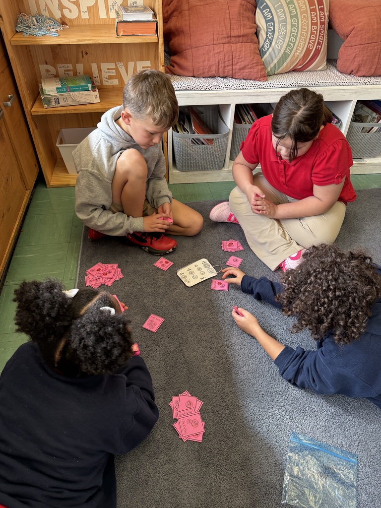 students playing a game on the floor